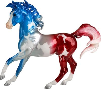 Breyer Horses Traditional Series Americana Decorator Model Anthem #1858 With his mane and tail blowing like a flag in the wind, Anthem is a richly hued decorator model that pays tribute to America’s national anthem, “The Star-Spangled Banner.” His pinto coat takes on the familiar hues of red, white, and blue.