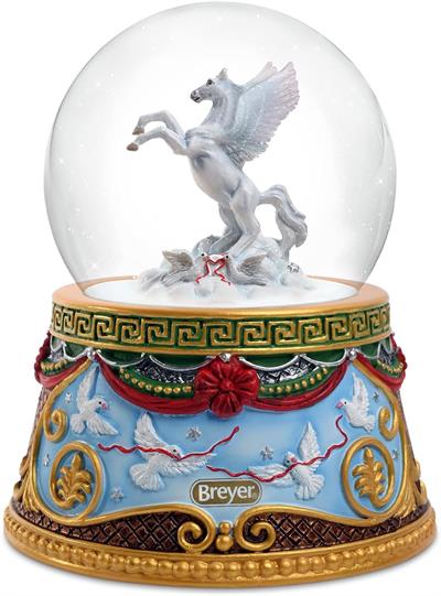 Breyer Horses 2023 Holiday Collection Holiday Flight Snow Globe - Pegasus # A brilliant white Pegasus takes flight amidst swirling snowflakes in this enchanting snow globe. With wings spread and golden hooves stretching out before it, the Pegasus soars above the star-filled clouds and a pair of doves.