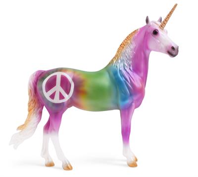 Keep the Peace is decorated in a rainbow of colors that appear to be tie dy Keep the Peace is decorated in a rainbow of colors that appear to be tie dyed, complimented by golden accents. He features a large peace sign on his right hip.