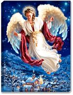 An elegant angel soars above a winter mountain side town scene. Brilliant sapphire blue night sky with stars above. Town features snow capped buildings, and a church with steeple.