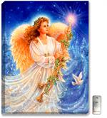 A beautiful young angel holds a golden candlestick. A peace dove softly flies by. Brilliant sapphire blue background with stars and snow dusted evergreen trees. 