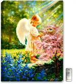 A young femal angel stands in the sunlight while standing in the forest with flowers